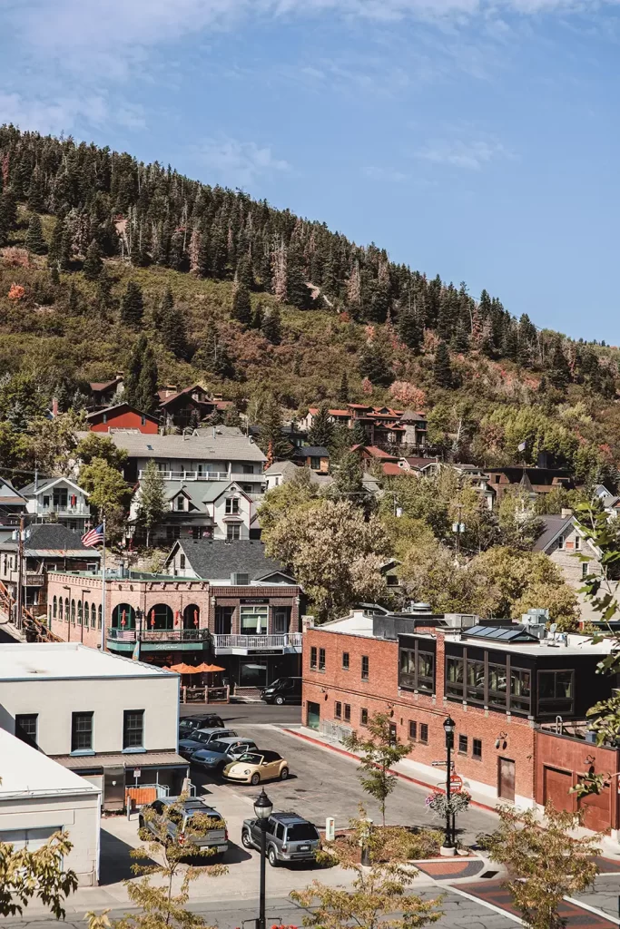 Idyllic view of Park City, Utah featuring a hillside village in autumn, showcasing quaint architecture and lush green scenery